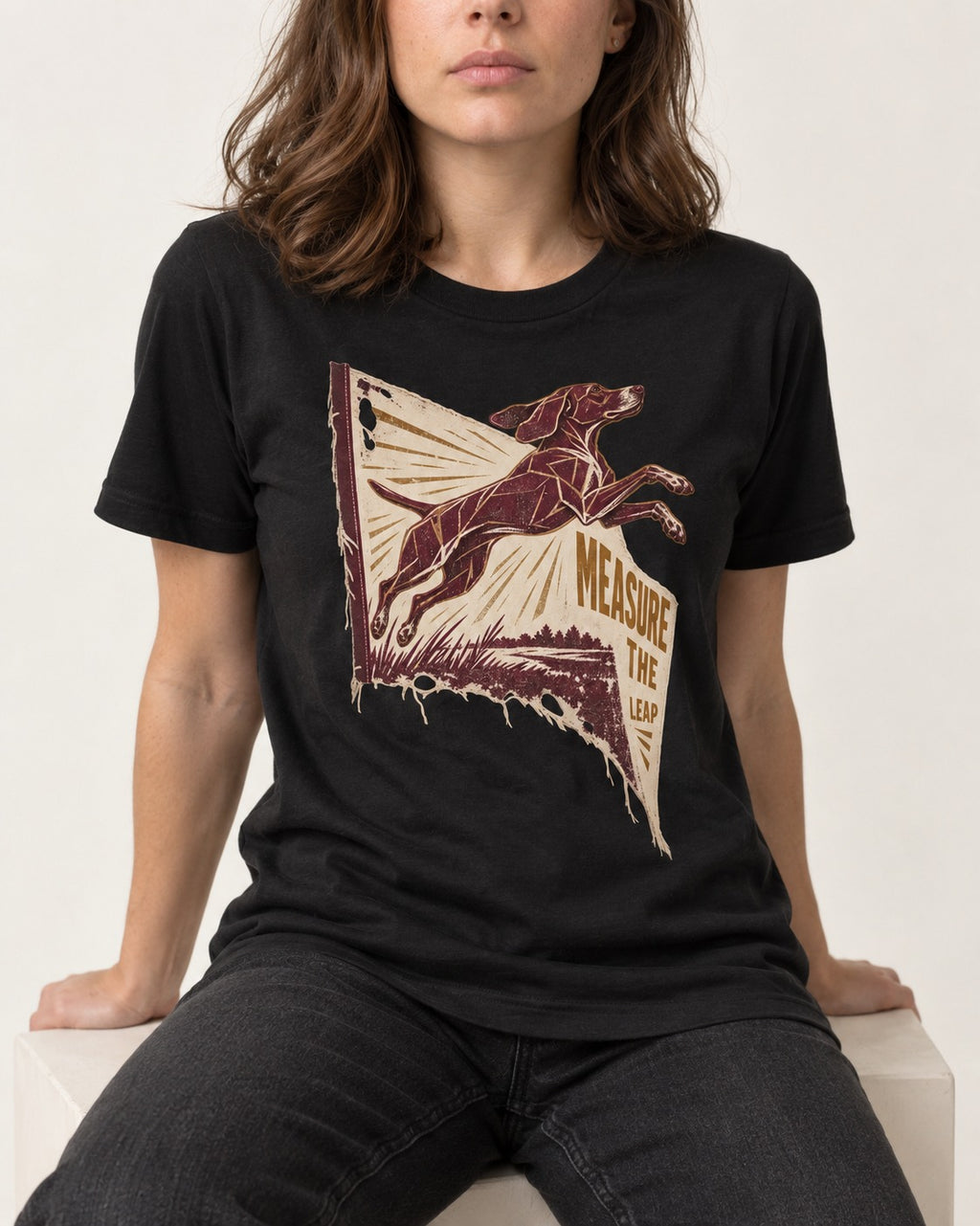 German Shorthaired Pointer Measure the Leap Torn Banner Graphic T-Shirt in Black, worn by a seated model