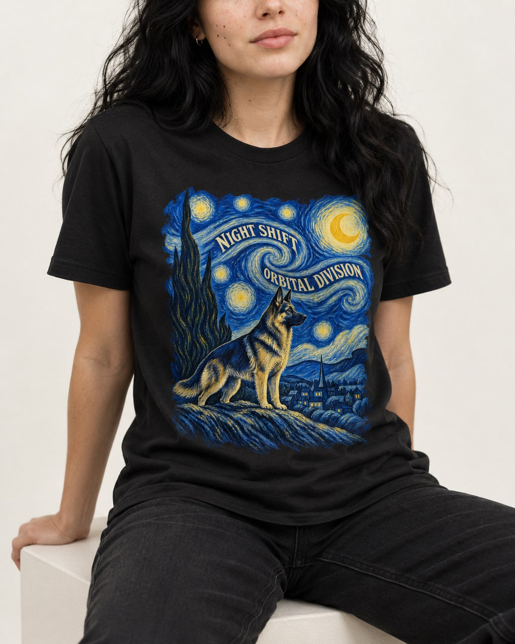 German Shepherd Dog Night Shift Orbital Division Starry Night T-Shirt in Black, worn by a seated model