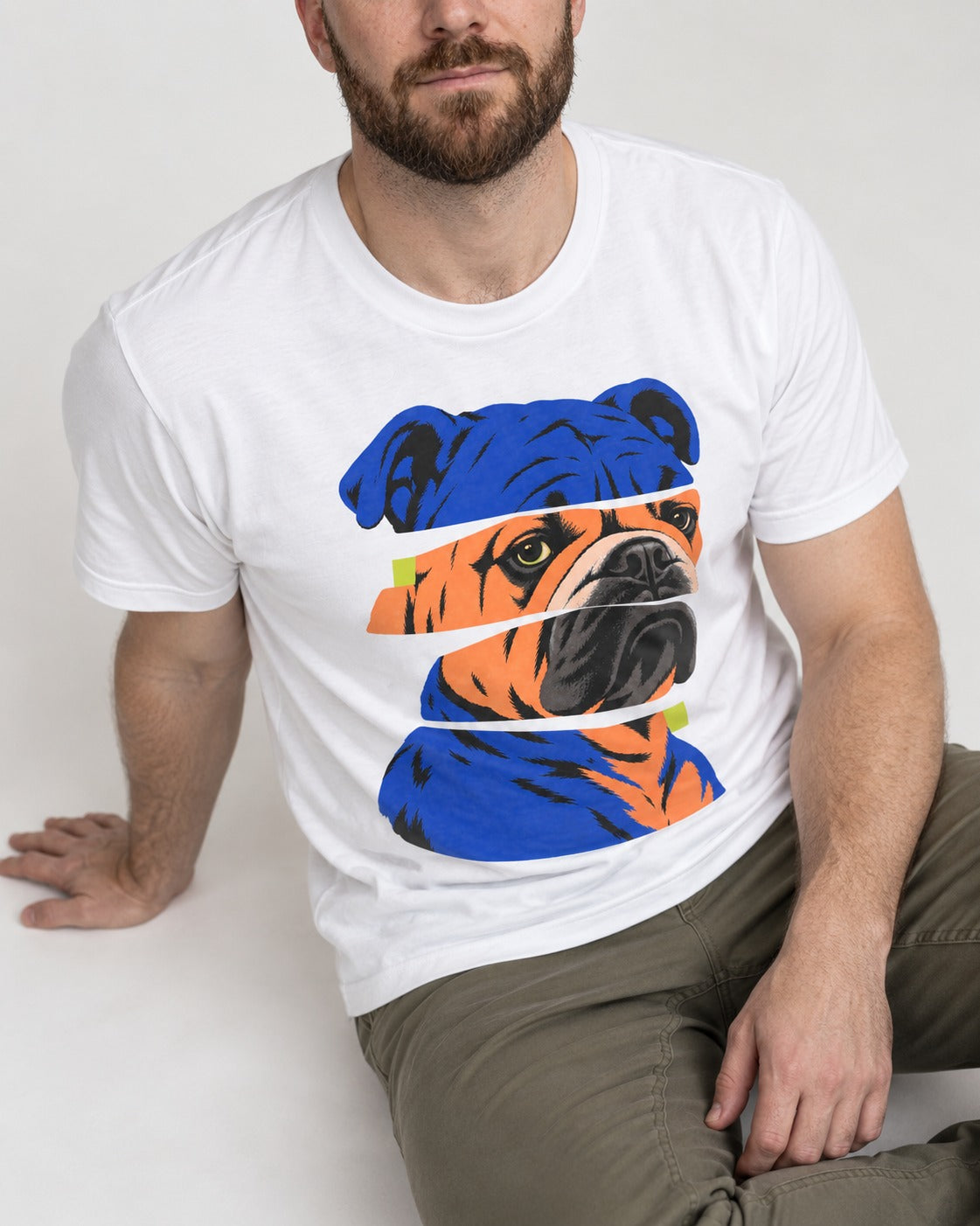 English Bulldog Unbreakable T-Shirt in White, worn by a seated model