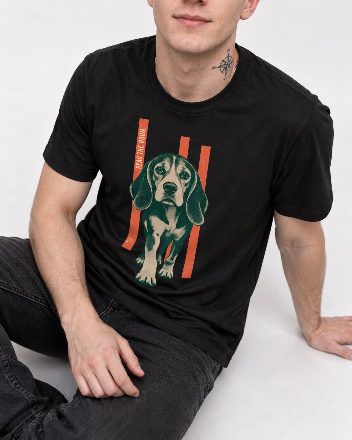 Beagle Before The Move Walking Portrait T-Shirt in Black, worn by a seated model