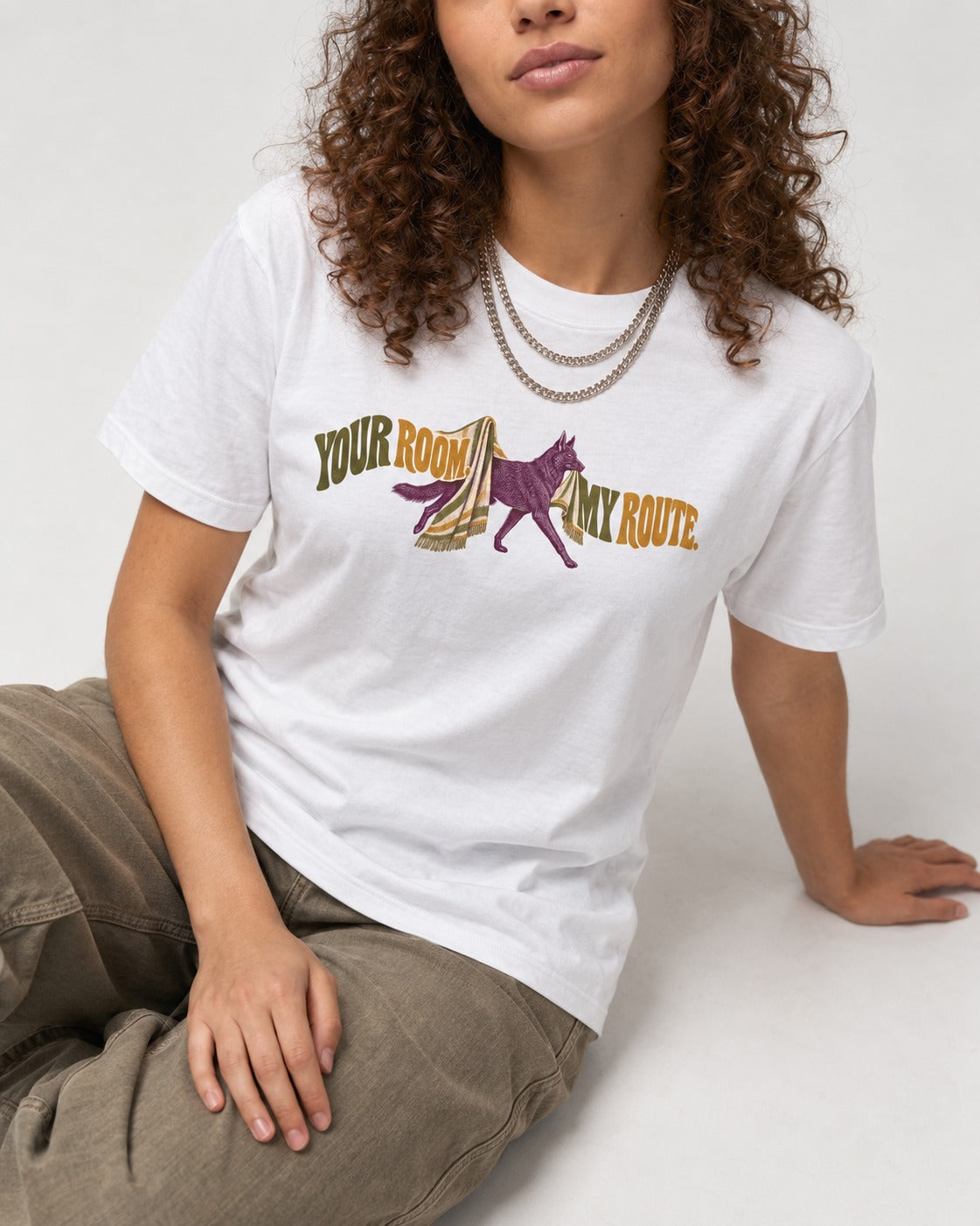 Your Room My Route German Shepherd Dog T-Shirt in White, worn by a seated model