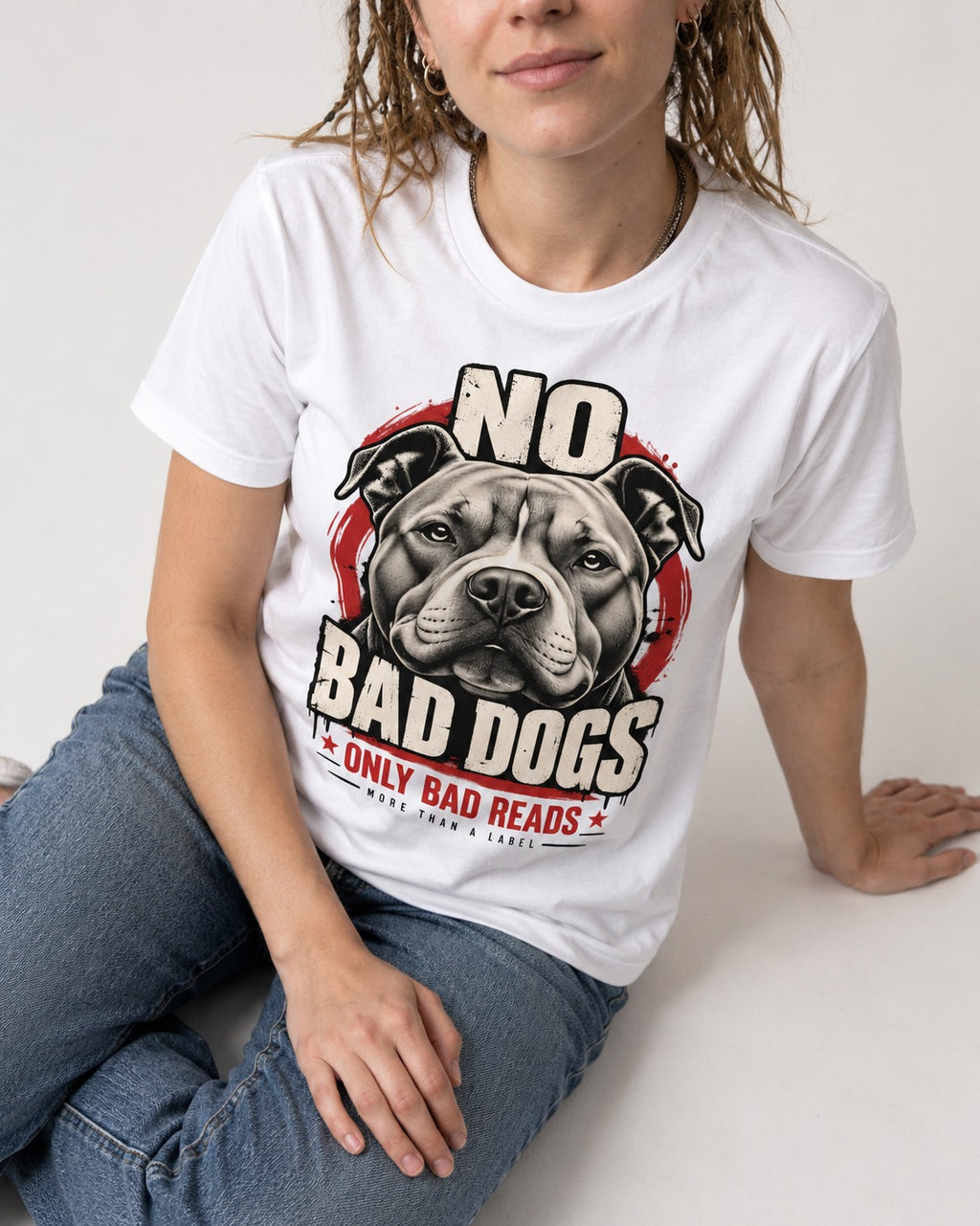 Pitbull Only Bad Reads T-Shirt in White, worn by a seated model