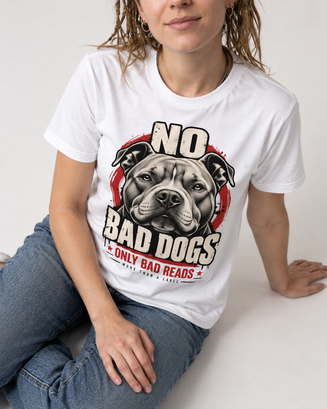Pitbull Only Bad Reads T-Shirt in White, worn by a seated model