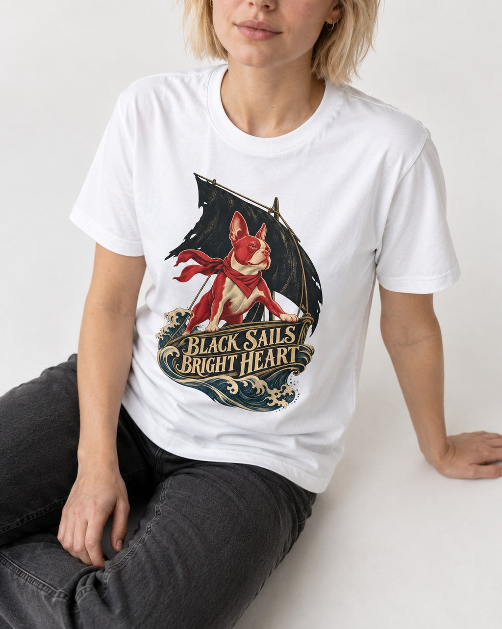 Black Sails Bright Heart Boston Terrier T-Shirt in White, worn by a seated model