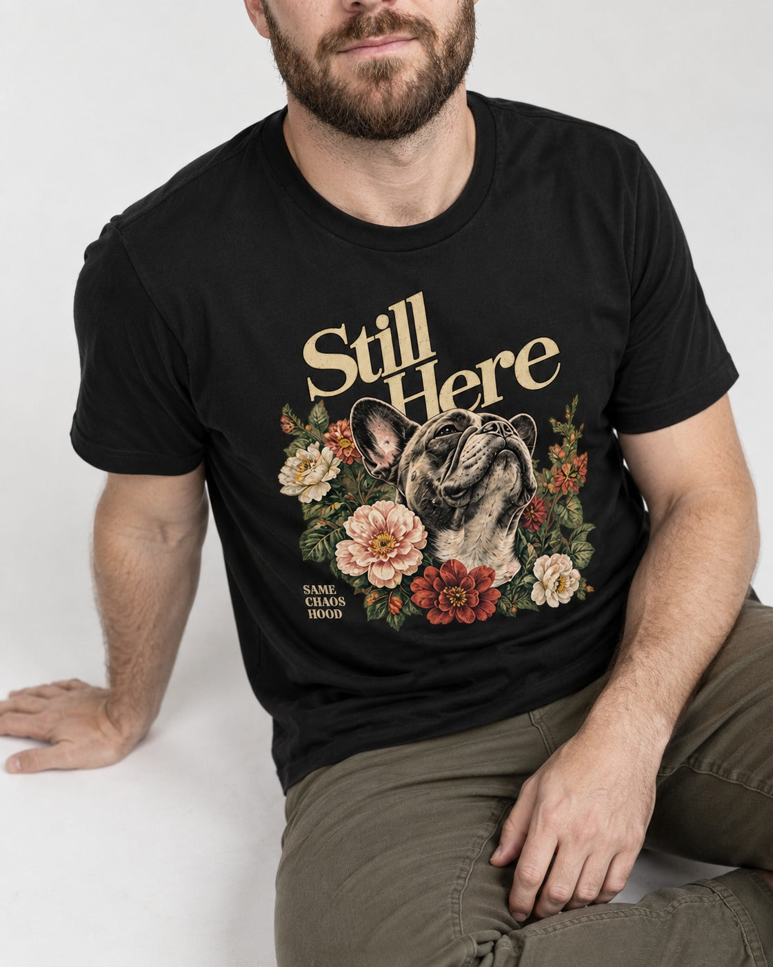 Frenchie Still Here Floral Portrait Graphic T-Shirt in Black, worn by a seated model