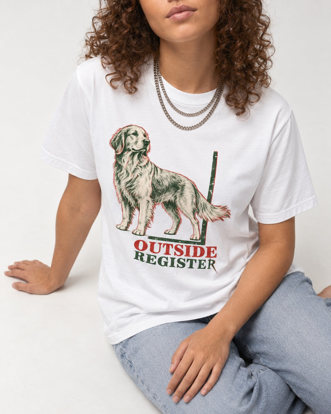 Outside Register Golden Retriever T-Shirt in White, worn by a seated model