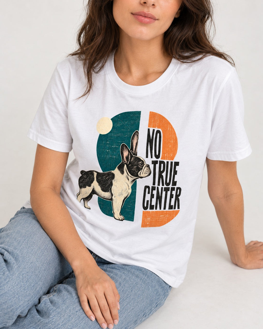 No True Center Frenchie T-Shirt in White, worn by a seated model