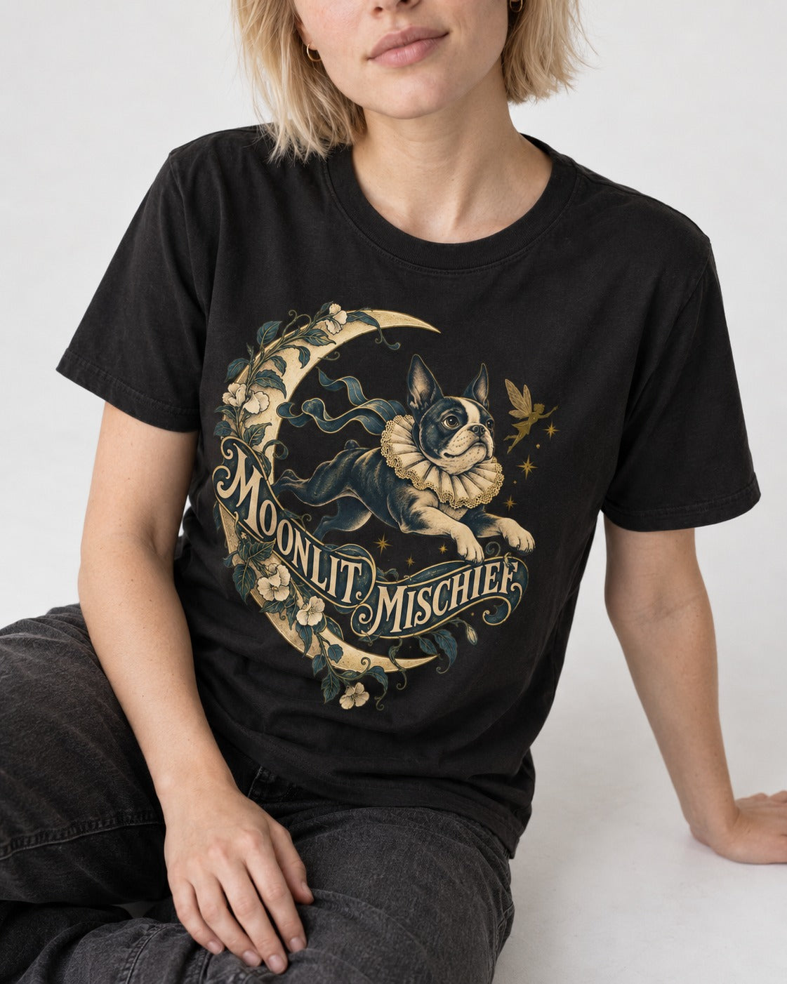 Boston Terrier Moonlit Mischief T-Shirt in Black, worn by a seated model