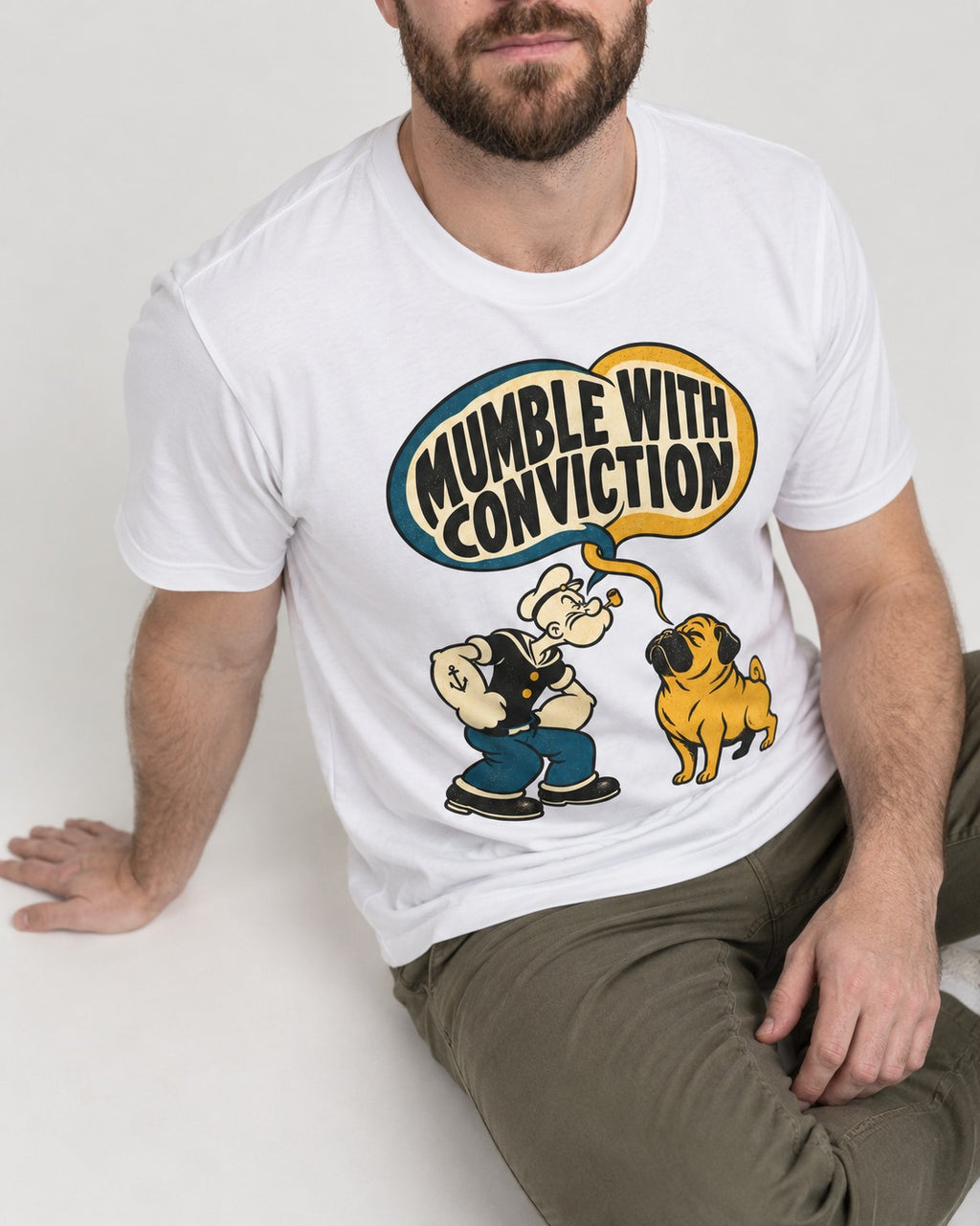 Pug Mumble with Conviction T-Shirt in White, worn by a seated model
