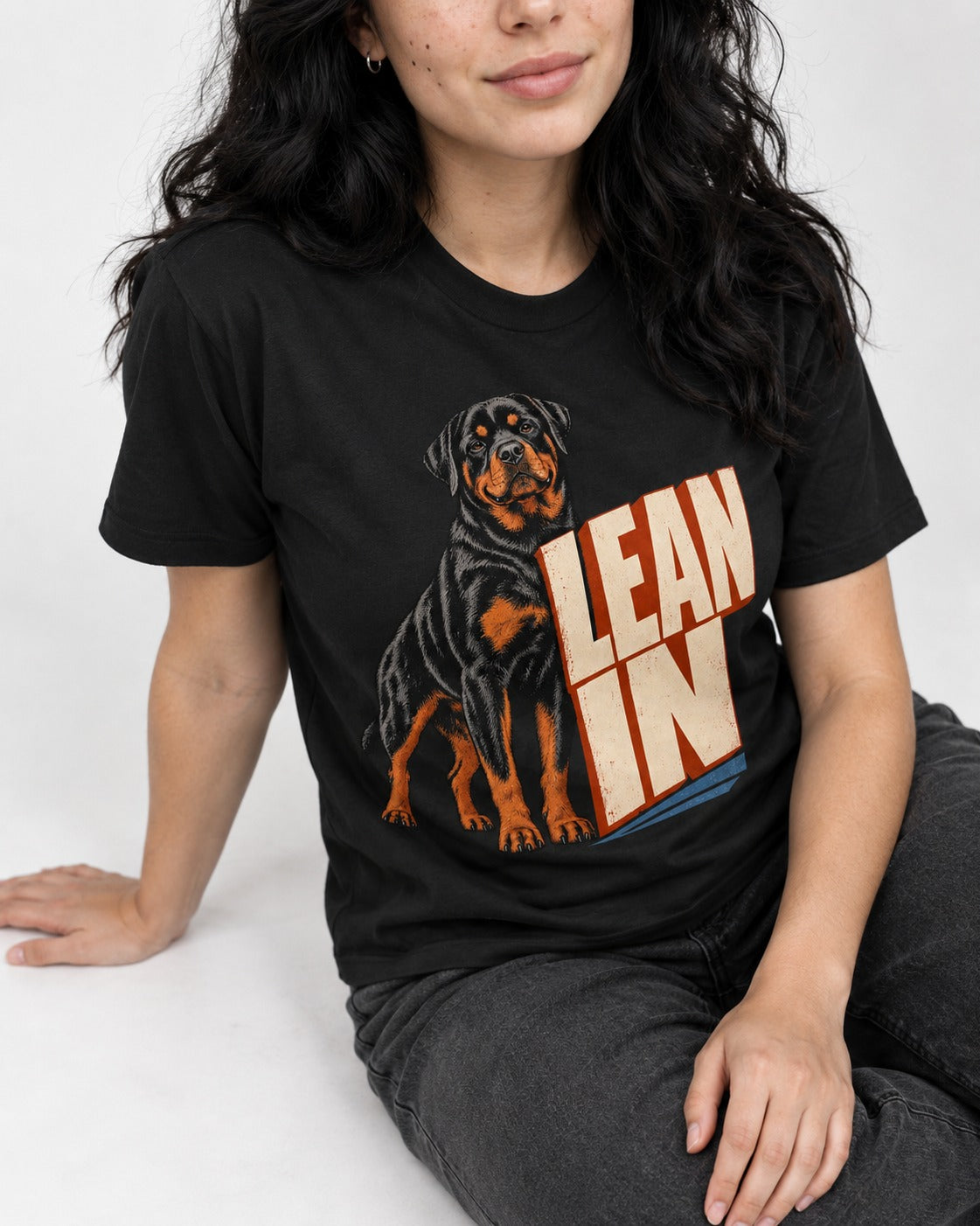 Rottweiler Lean In Block Typography Graphic T-Shirt in Black, worn by a seated model