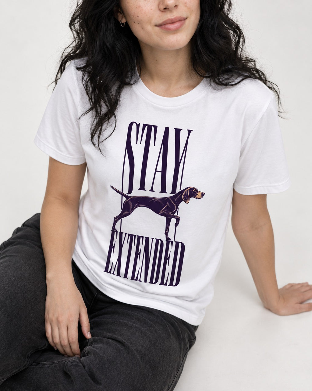 Stay Extended German Shorthaired Pointer T-Shirt in White, worn by a seated model