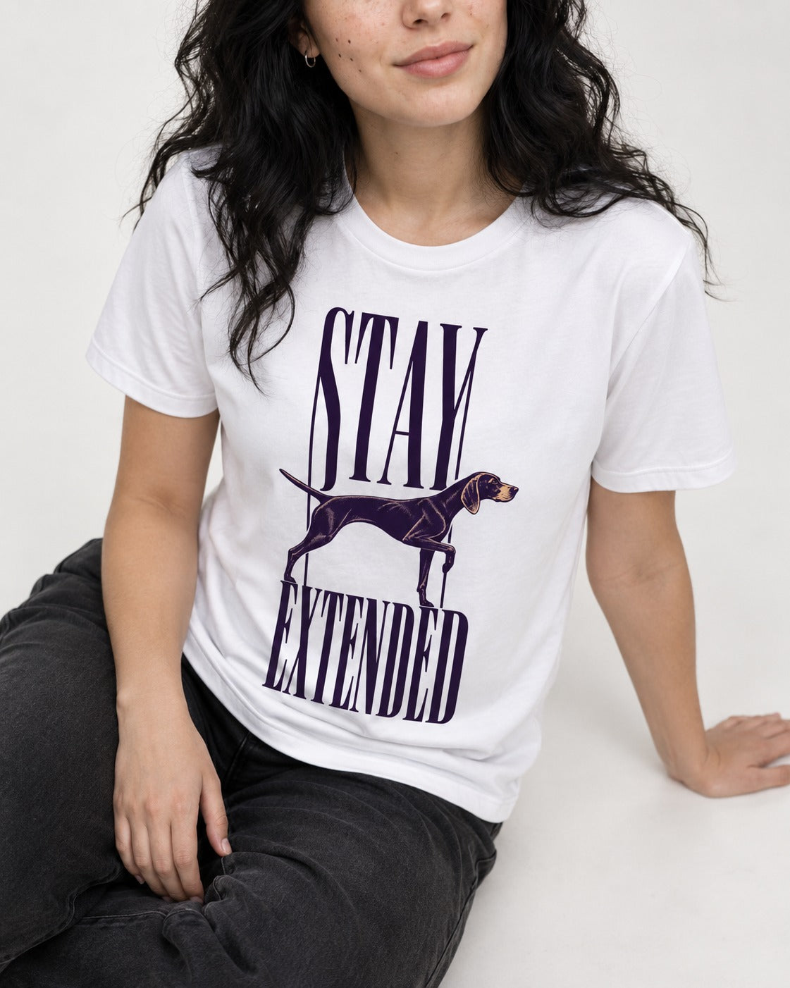 Stay Extended German Shorthaired Pointer T-Shirt in White, worn by a seated model