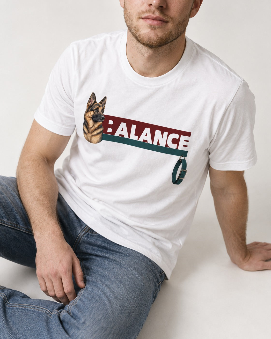 German Shepherd Dog Balance T-Shirt in White, worn by a seated model