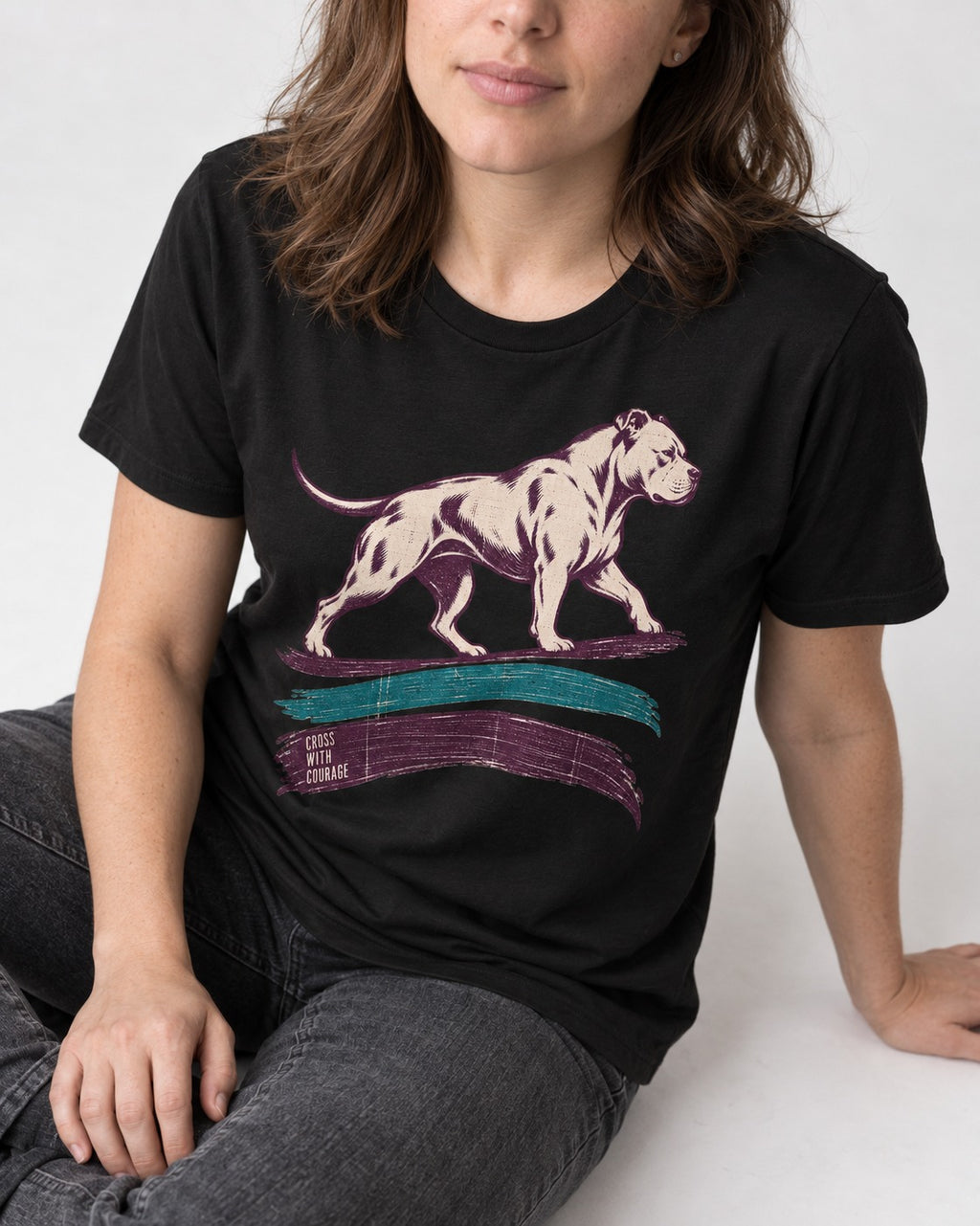 Pitbull Cross with Courage Brushstroke Graphic T-Shirt in Black, worn by a seated model