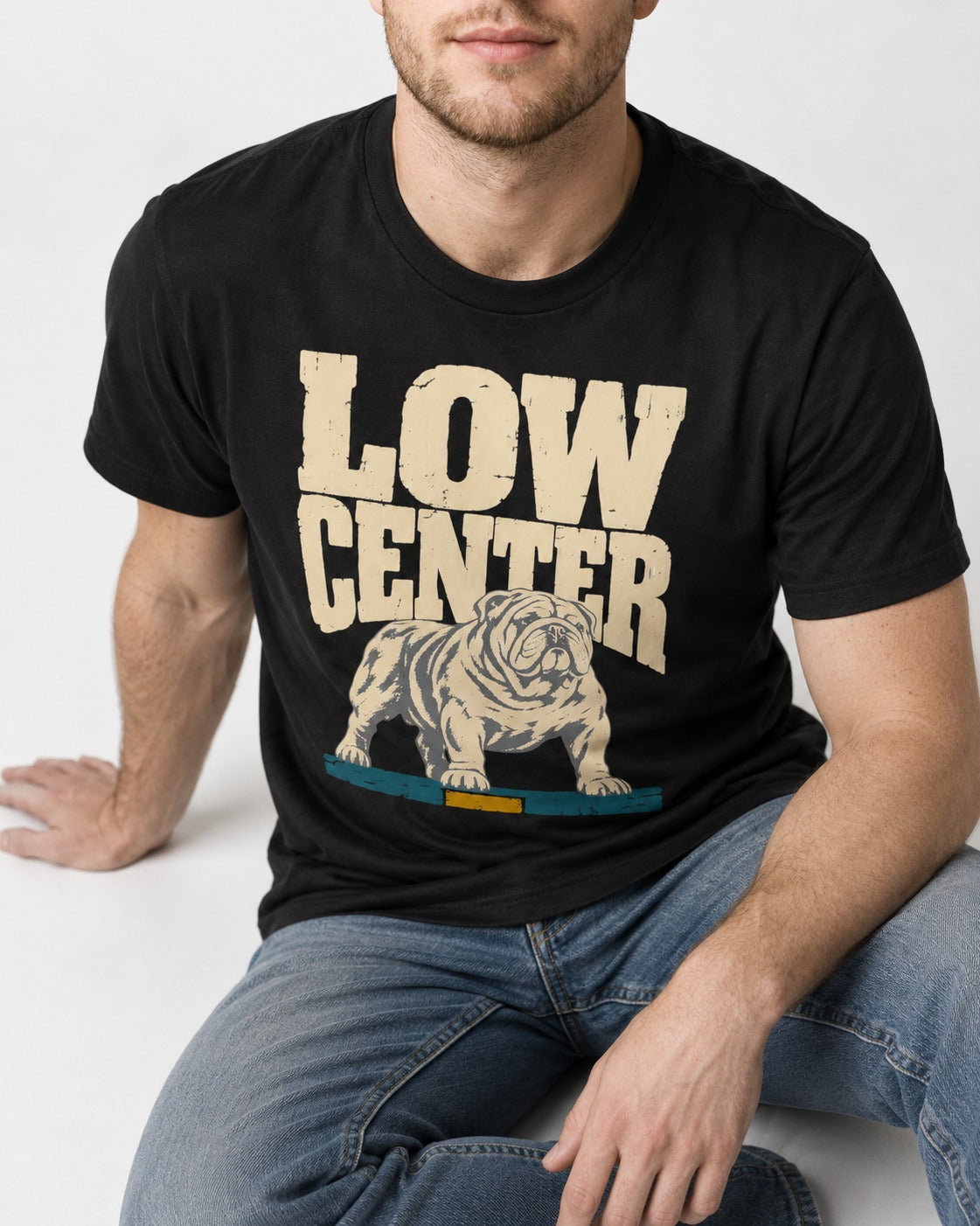English Bulldog Low Center Stance Graphic T-Shirt in Black, worn by a seated model