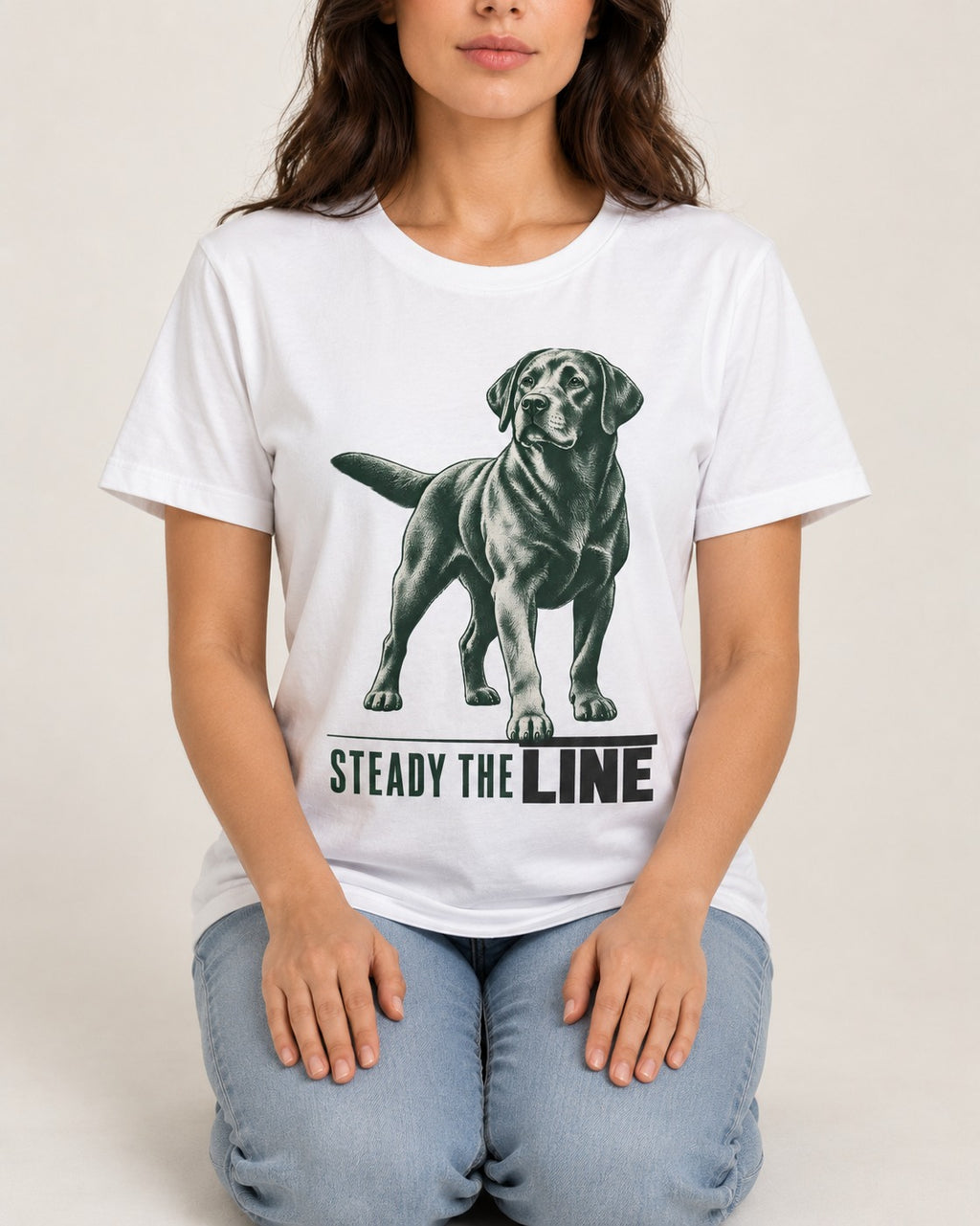 Steady the Line Labrador Retriever T-Shirt in White, worn by a seated model