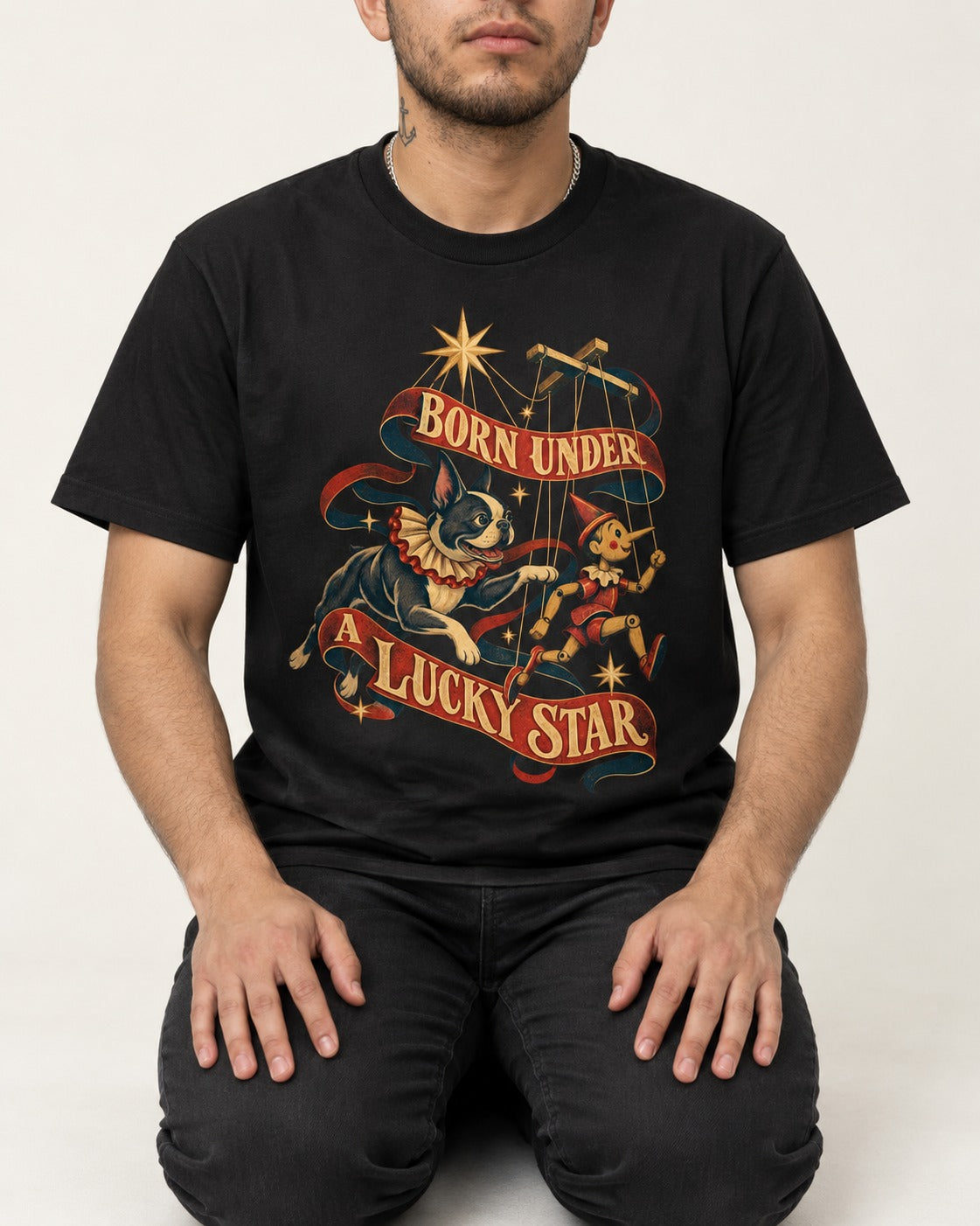 Born Under a Lucky Star Boston Terrier T-Shirt in Black, worn by a seated model