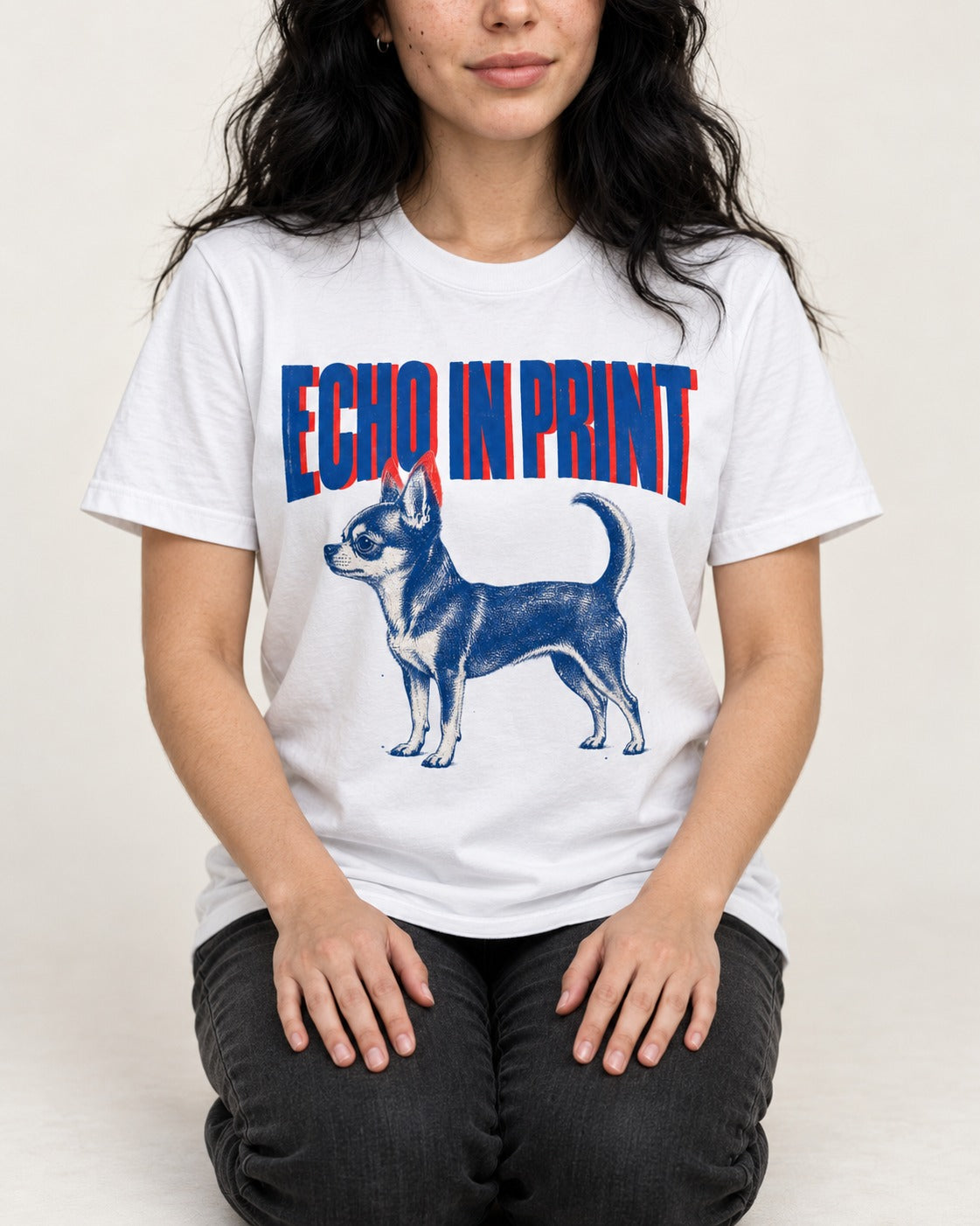 Chihuahua Echo T-Shirt in White, worn by a seated model
