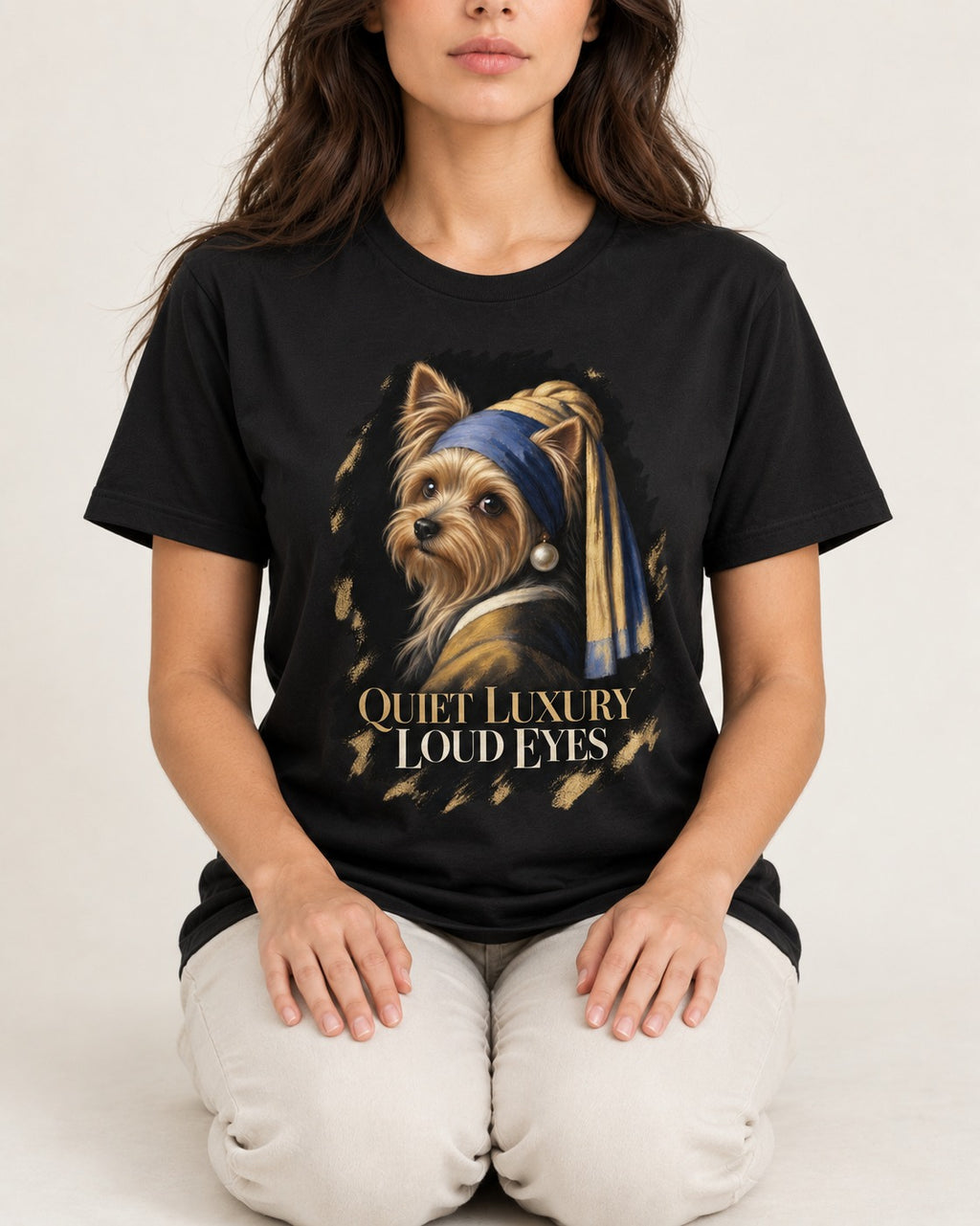Yorkshire Terrier Quiet Luxury Loud Eyes Pearl Portrait Graphic T-Shirt in Black, worn by a seated model