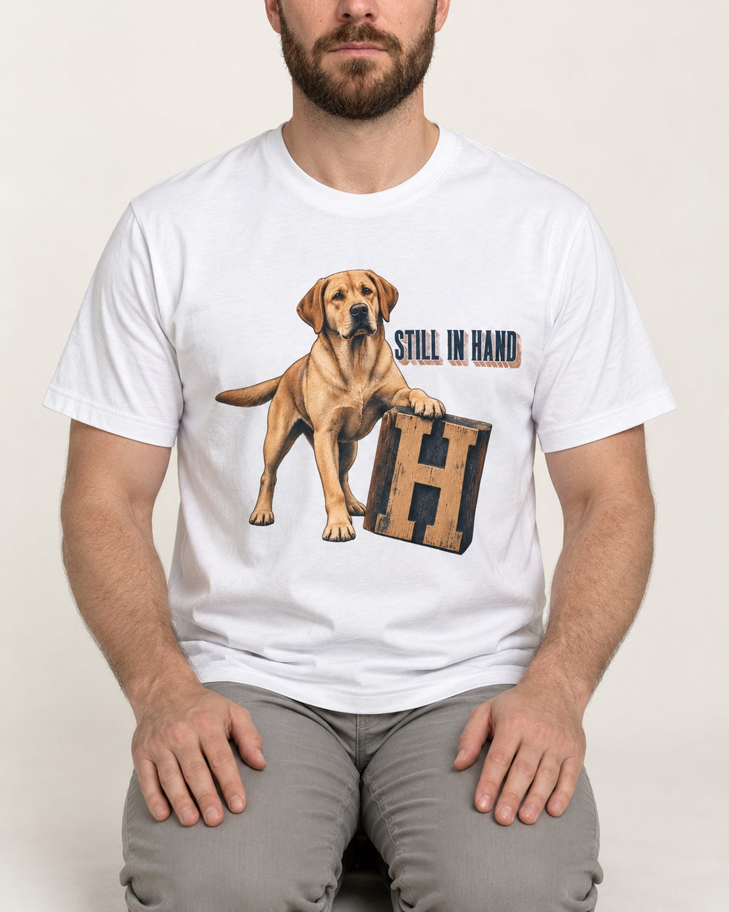 Labrador Retriever Still in Hand T-Shirt in White, worn by a seated model