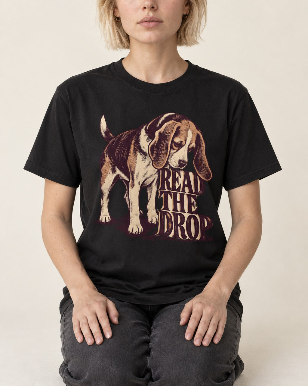 Beagle Read The Drop T-Shirt in Black, worn by a seated model