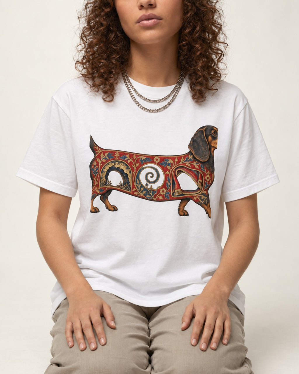 Dachshund Ever After T-Shirt in White, worn by a seated model