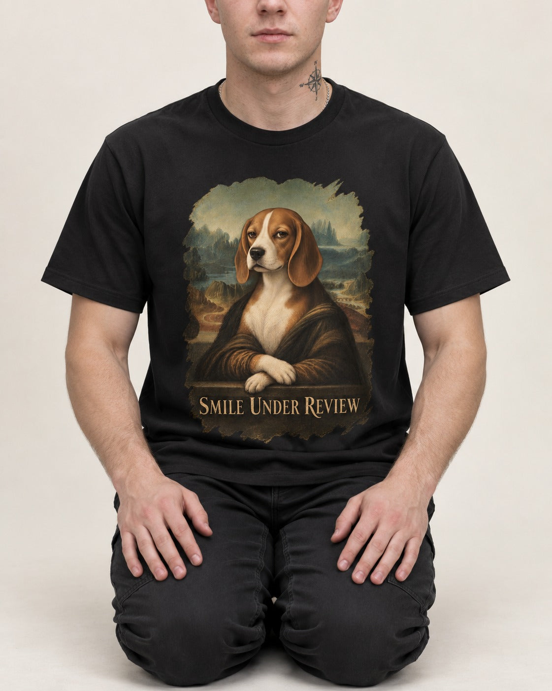 Smile Under Review Beagle Portrait T-Shirt in Black, worn by a seated model