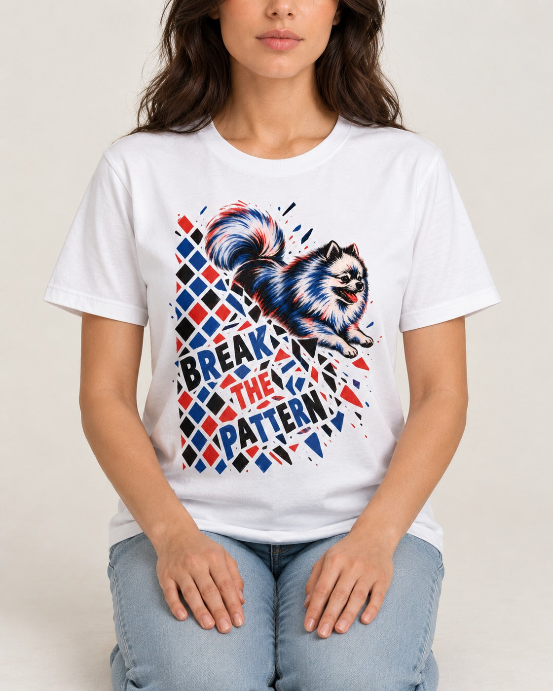 Pomeranian Break the Pattern T-Shirt in White, worn by a seated model