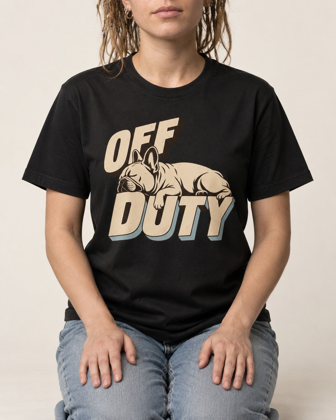 Frenchie Off Duty Sleeping Type Graphic T-Shirt in Black, worn by a seated model