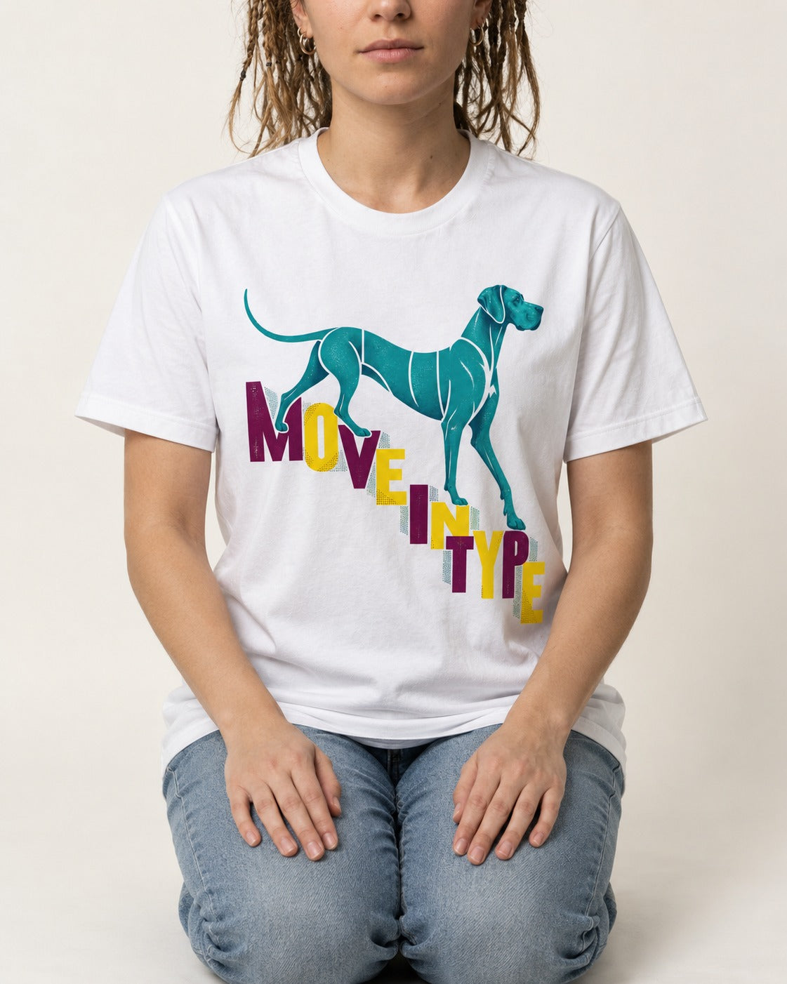 Great Dane Move in Type T-Shirt in White, worn by a seated model