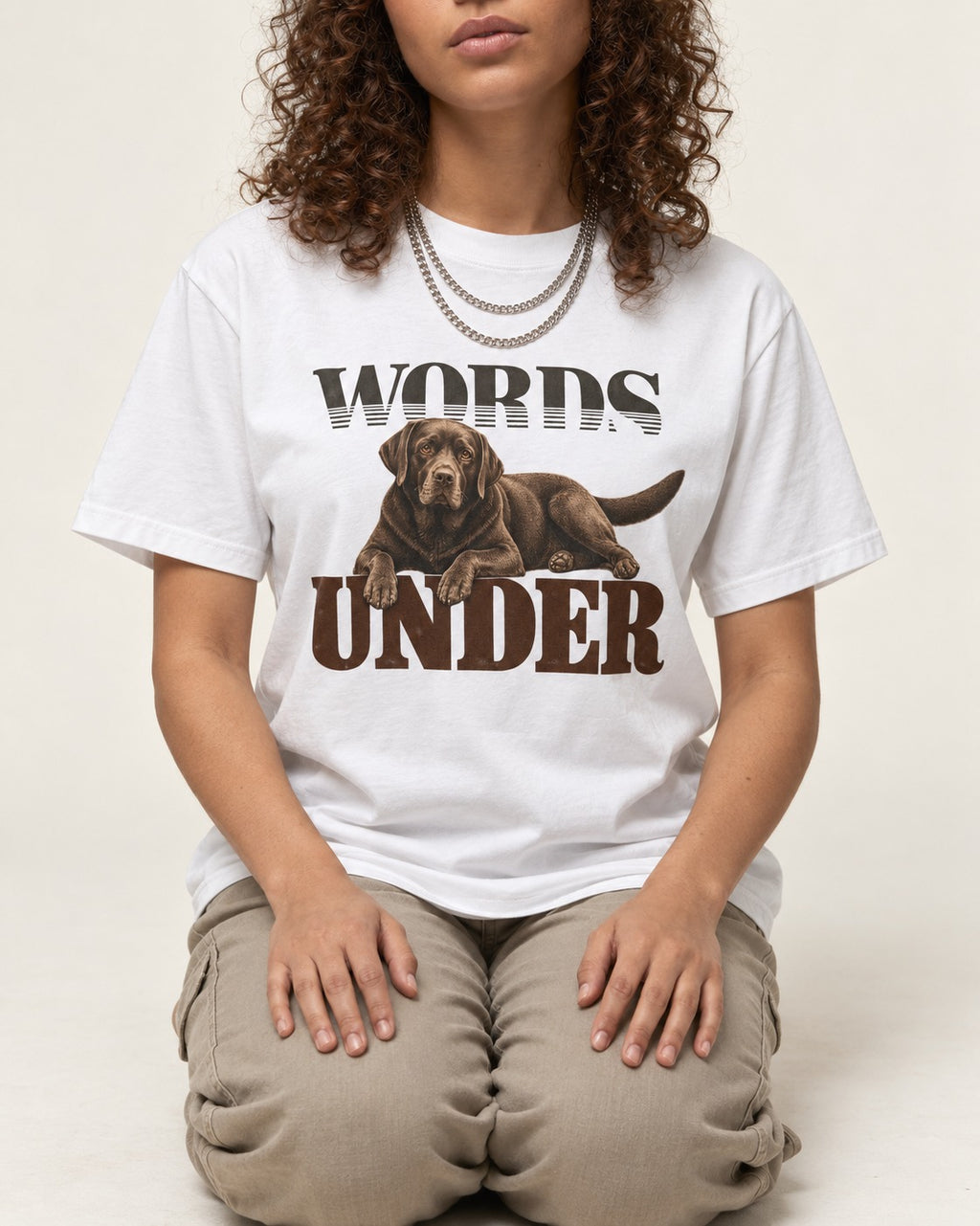 Words Under Labrador Retriever T-Shirt in White, worn by a seated model