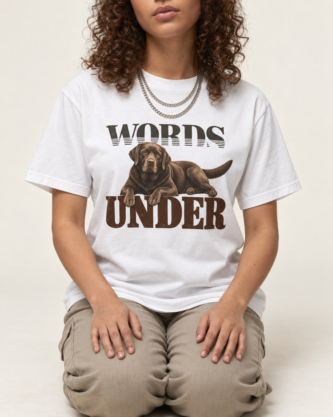 Words Under Labrador Retriever T-Shirt in White, worn by a seated model