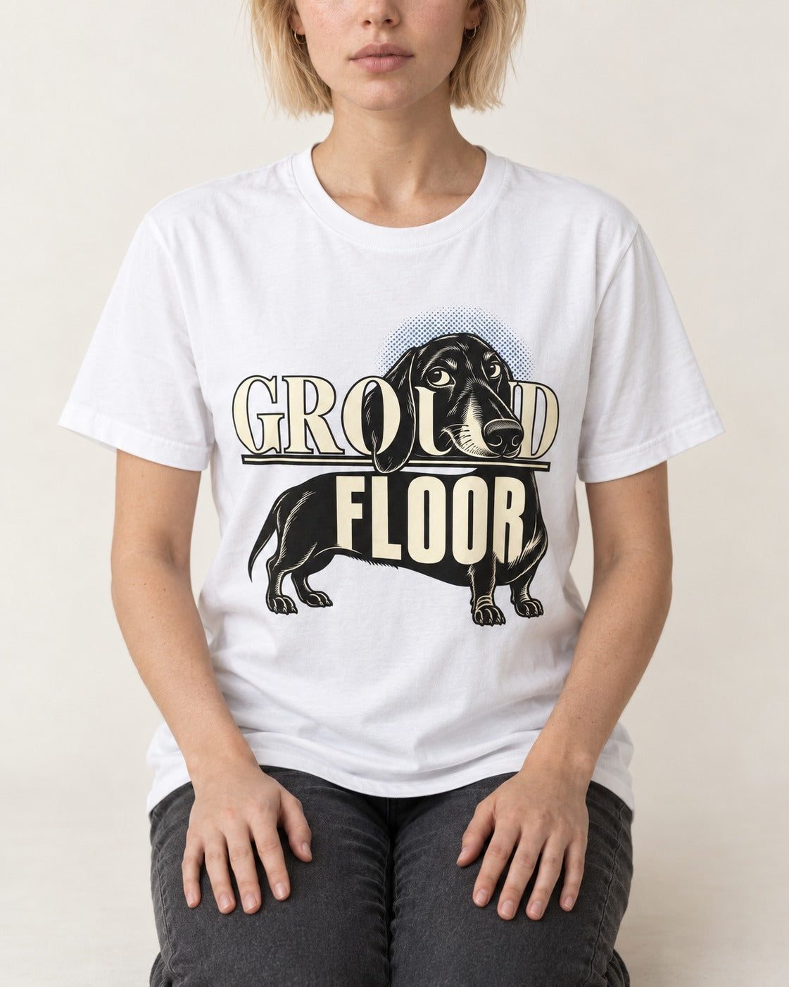 Ground Floor Dachshund T-Shirt in White, worn by a seated model