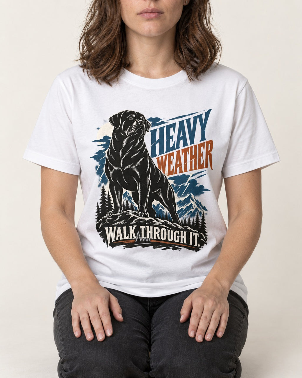 Heavy Weather Rottweiler T-Shirt in White, worn by a seated model