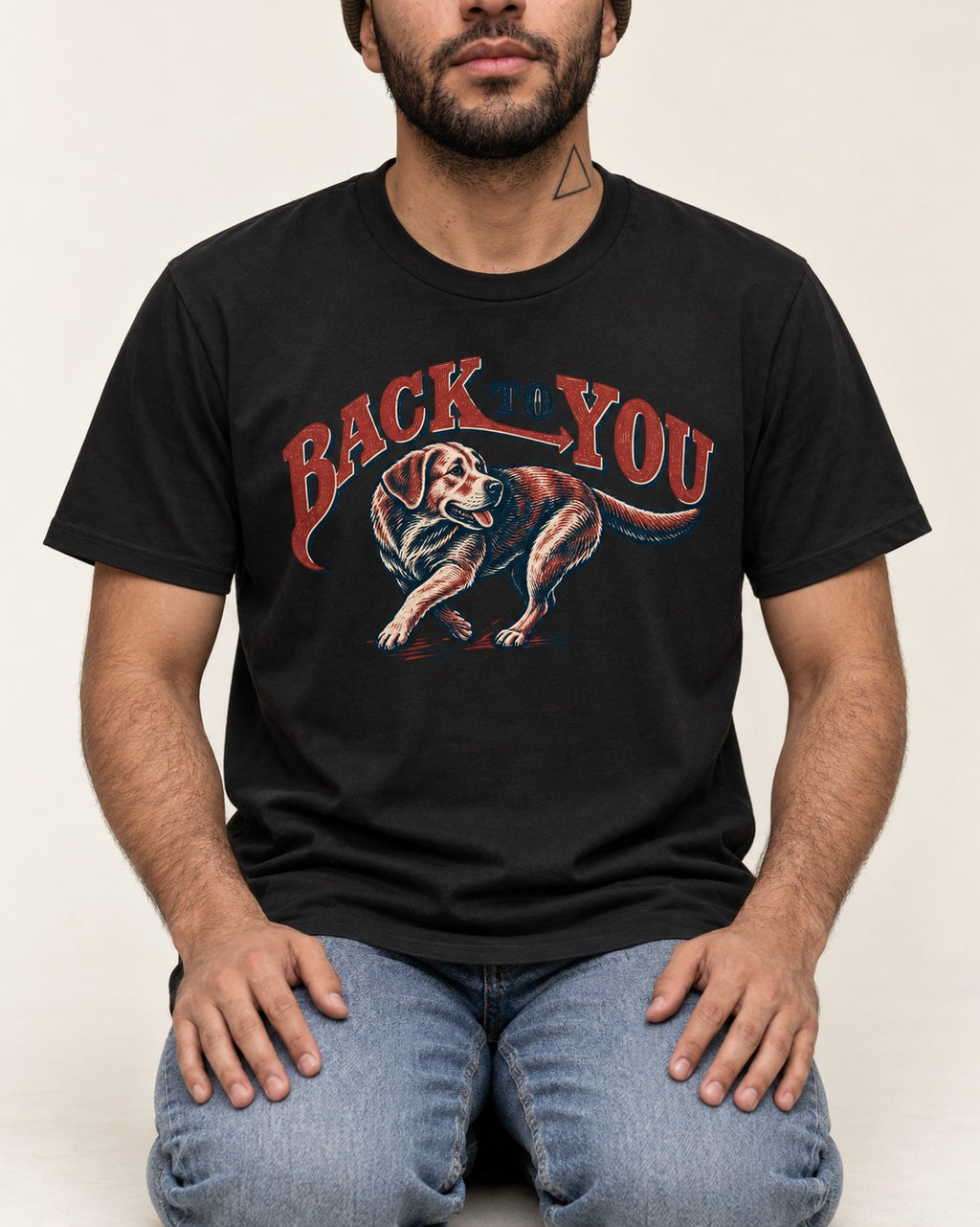 Labrador Retriever Back to You Turning Graphic T-Shirt in Black, worn by a seated model