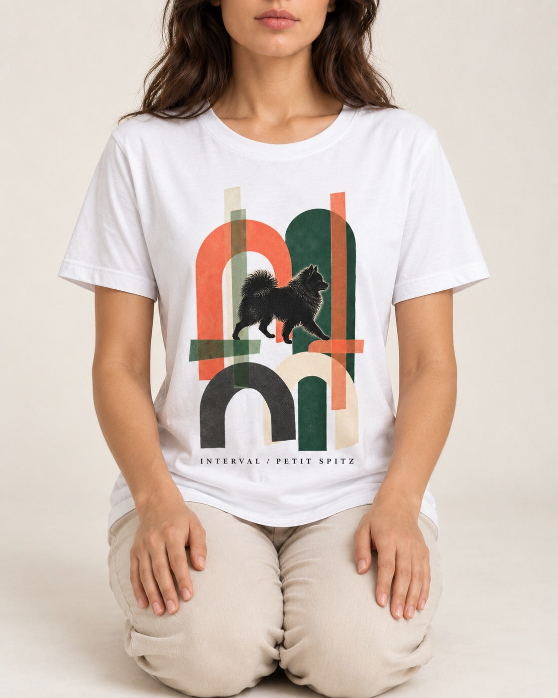 Pomeranian Interval T-Shirt in White, worn by a seated model