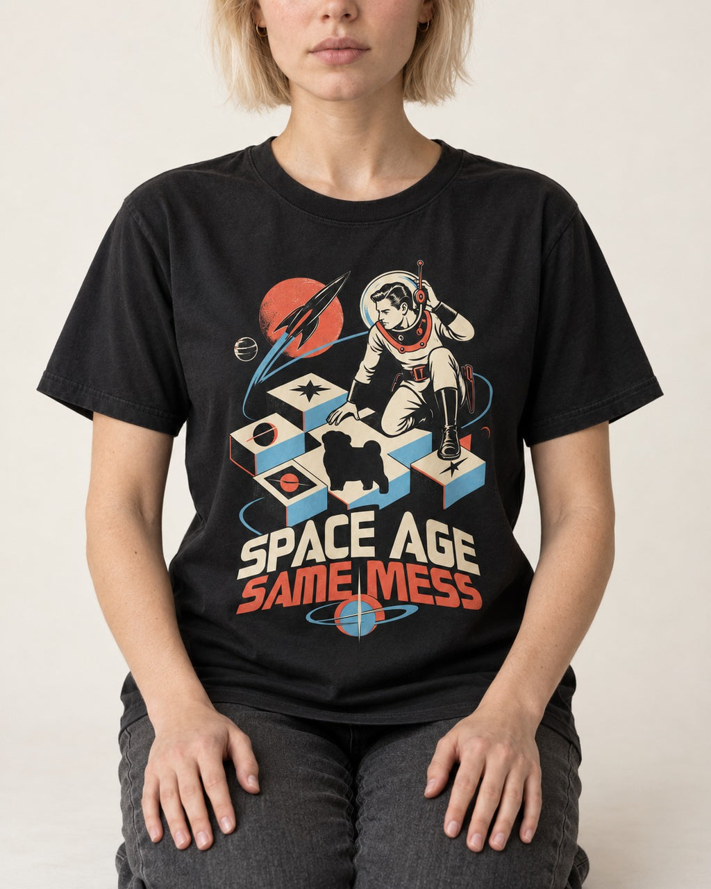 Pug Space Age Same Mess Astronaut Graphic T-Shirt in Black, worn by a seated model