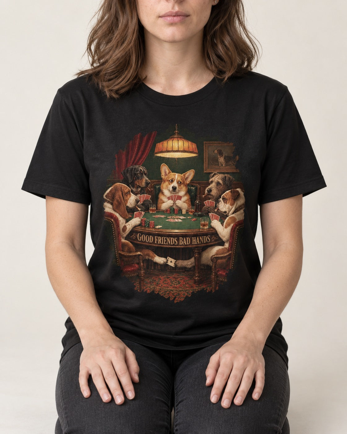 Corgi Good Friends Bad Hands Poker Night T-Shirt in Black, worn by a seated model
