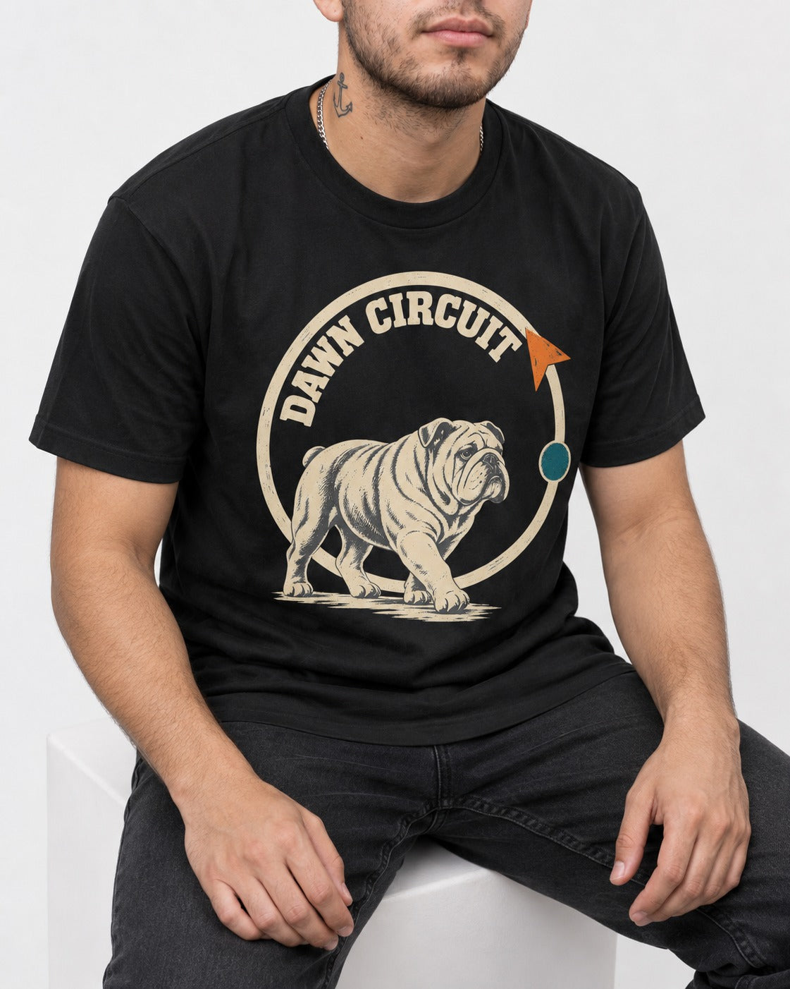 English Bulldog Dawn Circuit Emblem T-Shirt in Black, worn by a seated model