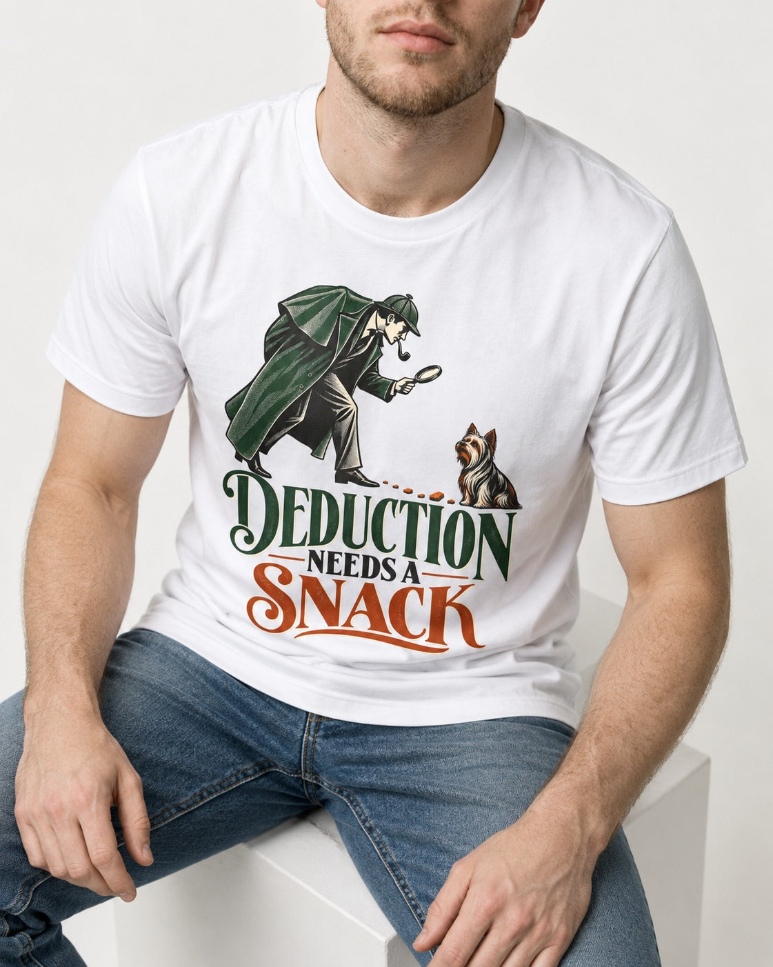 Yorkshire Terrier Needs a Snack T-Shirt in White, worn by a seated model