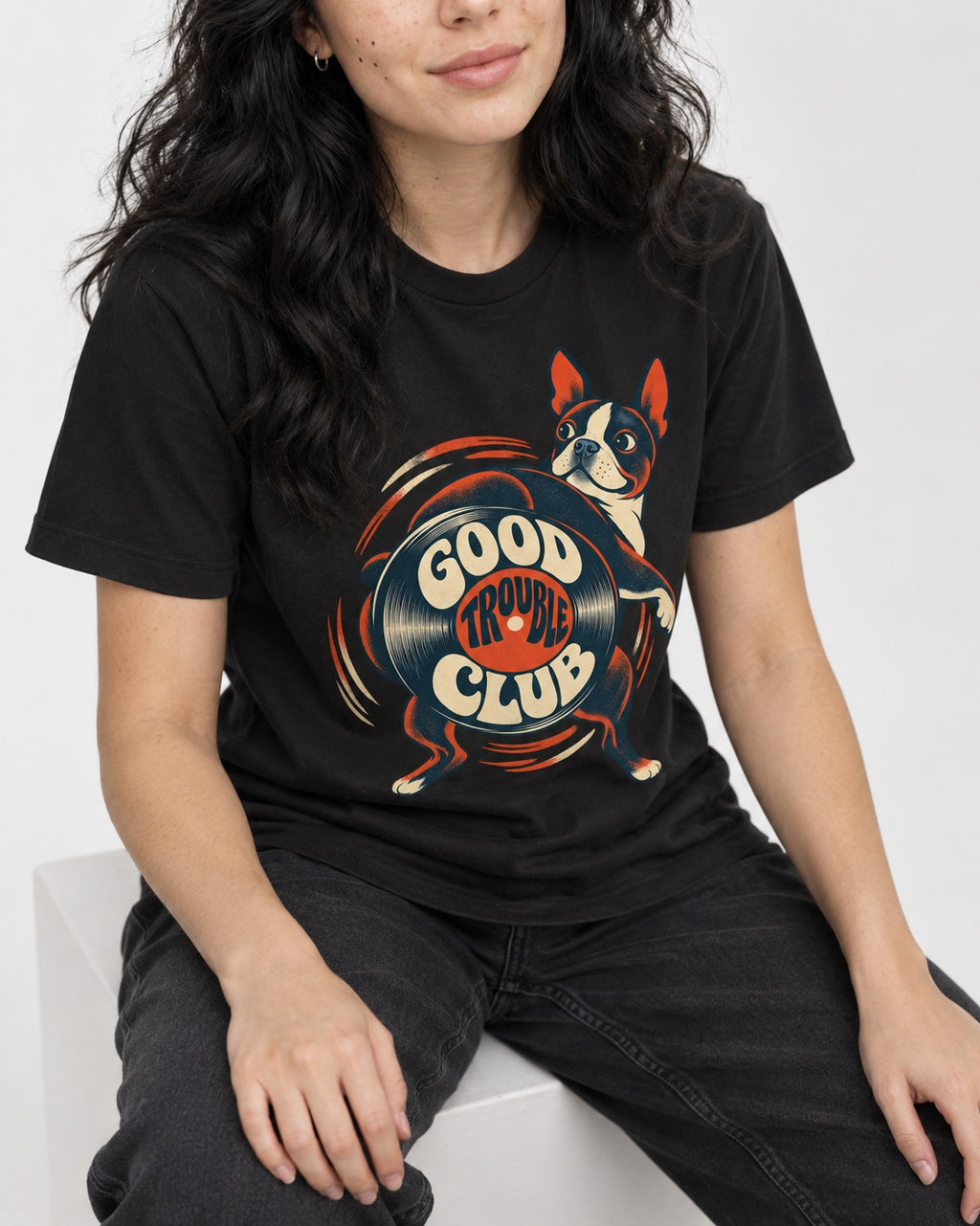 Good Trouble Club Boston Terrier T-Shirt in Black, worn by a seated model