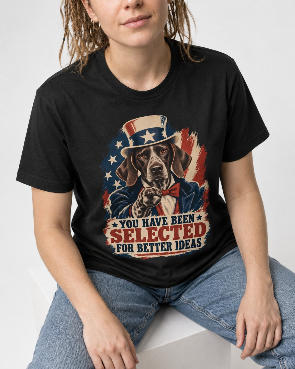 German Shorthaired Pointer You Have Been Selected For Better Ideas Uncle Sam Graphic T-Shirt in Black, worn by a seated model