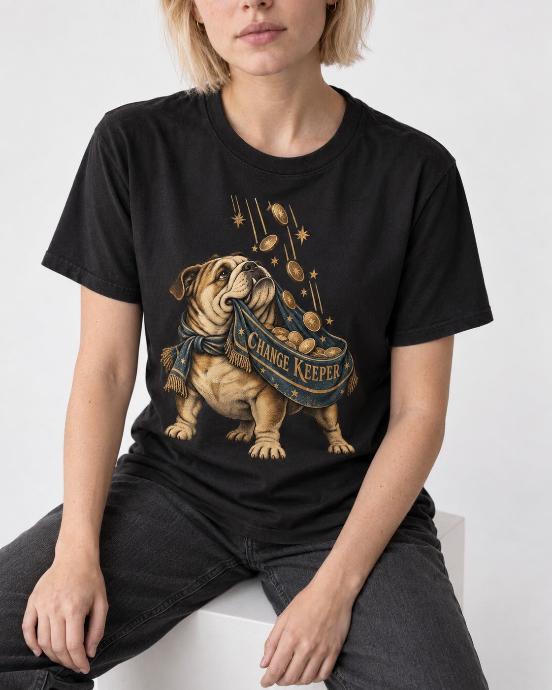 English Bulldog Change Keeper Coin Scarf Graphic T-Shirt in Black, worn by a seated model