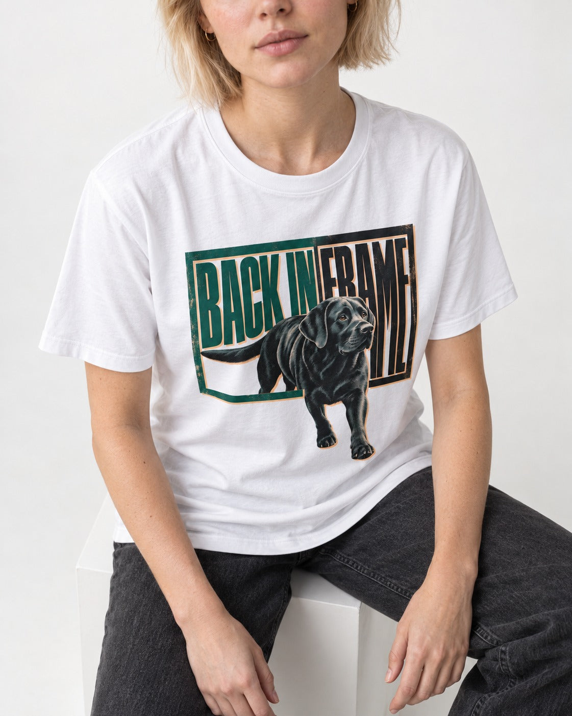 Labrador Retriever Back in Frame T-Shirt in White, worn by a seated model