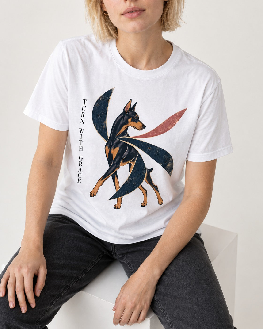 Turn with Doberman Grace T-Shirt in White, worn by a seated model