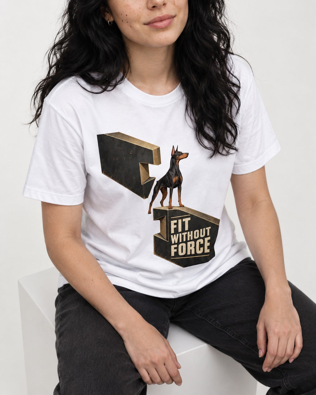 Doberman Fit Without Force T-Shirt in White, worn by a seated model