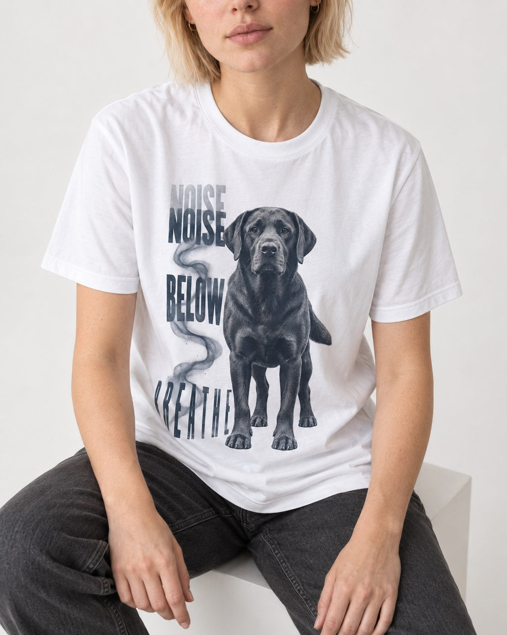 Labrador Retriever Breathe Below the Noise T-Shirt in White, worn by a seated model