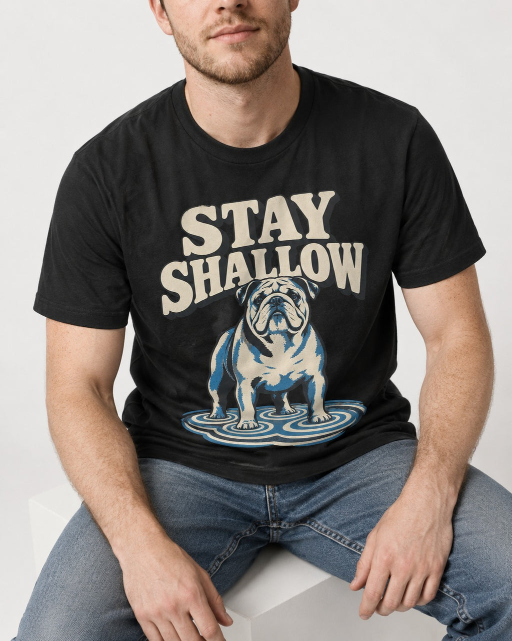 English Bulldog Stay Shallow Ripple Graphic T-Shirt in Black, worn by a seated model