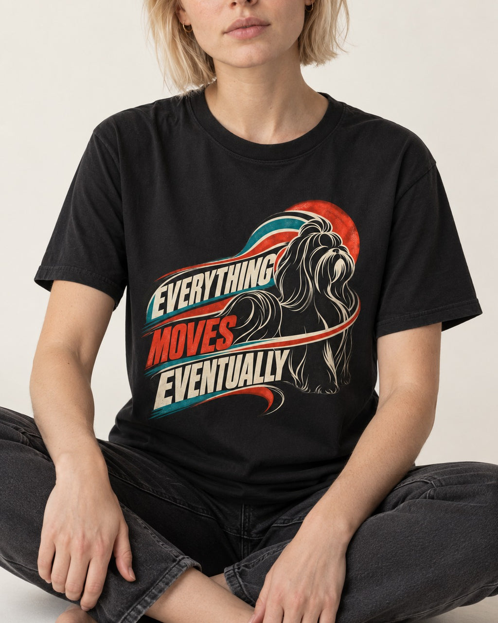 Shih Tzu Everything Moves Eventually Retro Speed Graphic T-Shirt in Black, worn by a seated model