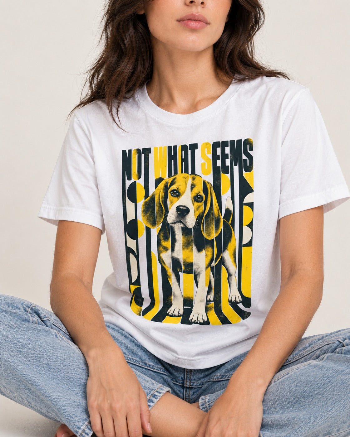 Not What It Seems Beagle T-Shirt in White, worn by a seated model